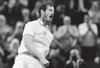  ?? AFP ?? Britain’s Andy Murray celebrates defeating Georgia’s Nikoloz Basilashvi­li in their first-round match at Wimbledon in London on Monday. The Scot, a champion at the All England Club in 2013, was making his first appearance at the grass-court Grand Slam in four years.