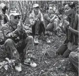  ?? ANNA KIM/AP ?? Paul Simon, left, joins in a ceremony during the planting of a lama tree at Auwahi Forest Reserve on Maui.