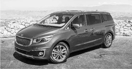  ?? Brendan McAleer / Driving ?? With shiny 19-inch wheels and LED-accented headlights, the top-level trim 2015 Kia Sedona serves up some very nice looks that are not typical of a minivan. It also comes with some nifty features, like a 360-degree around-view camera.