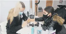  ?? Picture: Sarah Standing ?? PAMPERING Layla Barthaud (12) from Havant, having her nails done as treat with Jordan Hale, nail technician and beauty therapist, at Salon Dolly in West Street, Havant