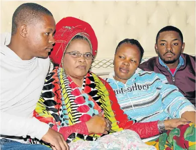  ?? Picture: FREDLIN ADRIAAN ?? DAY OF GRIEF: Distraught family members, from left, Malibongwe, Nomzi, Vuyiswa, and Sibongile Mngokoca mourn the death of Vuyisile Mngcokoca