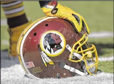  ?? NICK WASS / ASSOCIATED PRESS ?? The Washington Redskins asked the Supreme Court to hear its trademark dispute case along with the Slants, an Asian-American band.