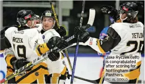  ?? PIC: AL GOOLD ?? Jake Ryczek (left) is congratula­ted after scoring for Nottingham Panthers.