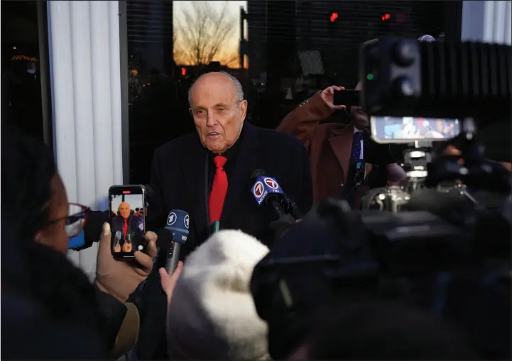  ?? SOPHIE PARK / NEW YORK TIMES FILE ?? Rudy Giuliani speaks to reporters Jan. 24 before a campaign event for Florida Gov. Ron Desantis in Manchester, N.H. Four months into bankruptcy proceeding­s, Giuliani’s financial disclosure­s have been incomplete, inaccurate and in some cases completely absent.