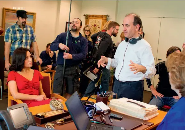  ??  ?? Above: On the set of Veep.Right: Armando Iannucci proudly holds his Order of the British Empire (OBE) medal after it was presented to him by the Prince of Wales during the Investitur­e Ceremony at Buckingham Palace.