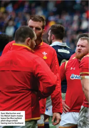  ??  ?? Sam Warburton and his Welsh team-mates leave the Murrayfiel­d pitch disgruntle­d having lost to Scotland