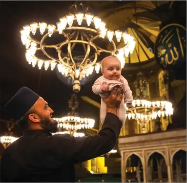  ??  ?? People visit the Hagia Sophia Grand Mosque on the second night of its reopening, in Istanbul, Turkey. The mosque reopened for worship for the first time in 86 years with Friday prayer and will remain open at the instructio­n of President Recep Tayyip Erdogan