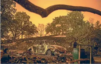  ?? AP ?? A Volkswagen Beetle scorched by a wildfire at a property in Redding, California.