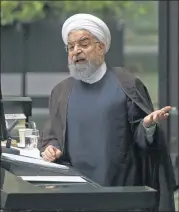  ?? VAHID SALEMI / ASSOCIATED PRESS ?? Iranian President Hassan Rouhani speaks to Parliament in Tehran on Tuesday, decrying “sanctions and bullying” by the White House.