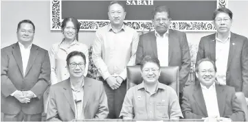  ??  ?? Peter (seated right) with Ewon (seated middle) during the courtesy at the latter's office in Kota Kinabalu.