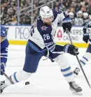  ?? ASSOCIATED PRESS PHOTOS ?? Among moves early on the first day of NHL free agency Saturday, the Rangers signed former Jets captain Blake Wheeler (left), while the Hurricanes brought in ex-Bruins defenseman Dmitry Orlov (right).