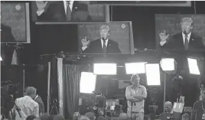  ?? JUSTIN SULLIVAN, GETTY IMAGES ?? Reporters watch the third U. S. presidenti­al debate Wednesday in Las Vegas. Media could have an historic role in the election of Hillary Clinton.