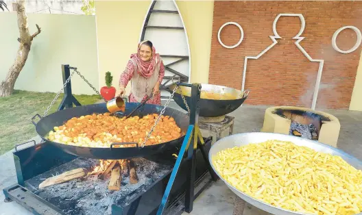  ?? VEG VILLAGE FOOD ?? More than 5 million followers tune in to a web series where they can watch Amar Kuar cook food from the simple setup in her family’s courtyard in her village in India.