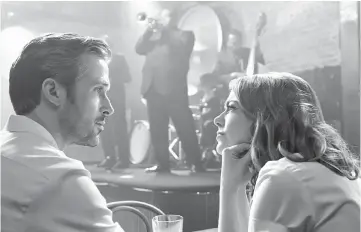  ??  ?? Sebastian (Gosling) and Mia (Stone) in ‘La La Land’. — Photo courtesy of Lionsgate