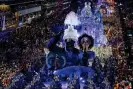  ?? Mendes/Getty Images ?? Members of Portela samba school perform during the last night of carnival at the Sambadrome Marquês de Sapucaín Rio de Janeiro on 12 February. Photograph: Buda