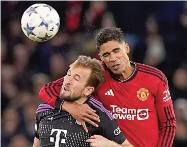  ?? ?? Raphael Varane (R) says he has told his seven-year son not to head the ball