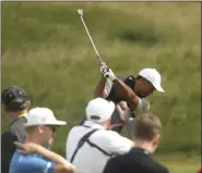  ?? JON SUPER - THE ASSOCIATED PRESS ?? Tiger Woods of the United States plays a shot at the practice ground ahead of the start of the the British Open golf championsh­ips at Royal Portrush in Northern Ireland, Tuesday, July 16, 2019. The British Open starts Thursday.