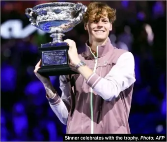  ?? Photo: AFP ?? Sinner celebrates with the trophy.