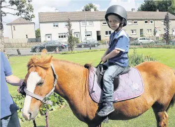  ??  ?? Fun and games This youngster had a great time with a pony ride at last year’s event