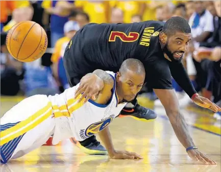  ?? Ezra Shaw Getty Images ?? IN ADDITION TO scoring 41 points in what could have been his team’s final game of he season, Kyrie Irving of the Cleveland Cavaliers was more than willing to get down and dirty with Andre Iguodala of the Golden State Warriors in pursuit of a loose ball.