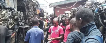  ??  ?? Traders at Apo Spare parts market, Abuja