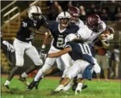  ?? (BARRY TAGLIEBER - DFM FILE ?? Pottsgrove’s Isaiah Taylor is off to the races as Pottstown’s Nehemiah Figueroa tries to bring him down.