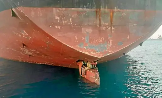  ?? AP ?? Spain’s Maritime Rescue Service rescued three stowaways travelling on a ship’s rudder in the Canary Islands after the vessel sailed there from Nigeria. The men were found on the Alithini II oil tanker at the Las Palmas port.
