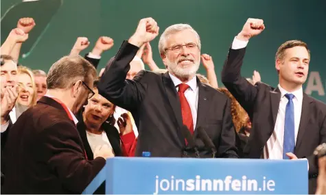  ??  ?? Sinn Fein leader Gerry Adams is surrounded by party colleagues after announcing his plans to stand down as leader in Dublin on Saturday. (AFP)