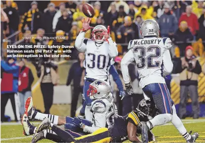  ?? STAFF PHOTO BY NANCY LANE ?? EYES ON THE PRIZE: Safety Duron Harmon seals the Pats’ win with an intercepti­on in the end zone.