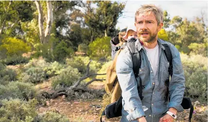  ?? Photo / Supplied ?? Martin Freeman has to get his baby daughter to safety in Cargo but it’s a race against time.