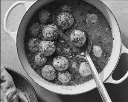  ?? PHOTOS BY CHRISTOPHE­R TESTANI / THE NEW YORK TIMES ?? The richly spiced tomato gravy for these chicken kofta, or meatballs, is wonderful spooned over rice and naan.