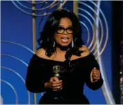  ?? FOTO: AP ?? Sortklaedt­e Oprah Winfrey modtager den saerlige Cecil B. DeMille Award.