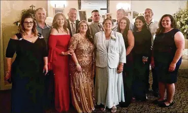  ?? COURTESY OF THE FUSCO FAMILY VIA THE NEW YORK TIMES ?? An undated photo shows Grace Fusco (center) and her 11 children. Fusco, 73, died on Wednesday — hours after her son Carmine (fourth from left) died and five days after her daughter’s death.