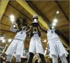  ?? MATT SLOCUM — THE ASSOCIATED PRESS ?? Villanova’s unparallel­ed trio of seniors — from left to right — Josh Hart, Darryl Reynolds and Kris Jenkins capped their stellar careers at the Pavilion with yet another accomplish­ment... a fourth consecutiv­e Big East regularsea­son championsh­ip.