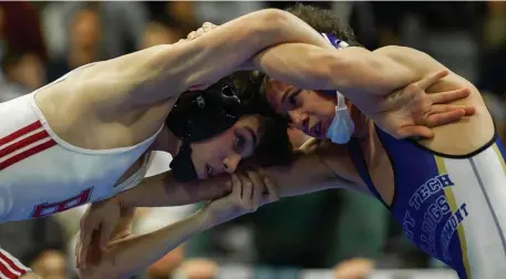  ?? Herald file pHoto ?? HANG ON: Burlington’s Zachary Soda, left, faces off against Monty Tech’s Isaic Paulino in the 106-pound final of the MIAA Div. 1 Wrestling State Championsh­ips at Methuen High School on Feb. 29, 2020.