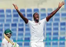  ?? AFP ?? Jason Holder appeals for a leg-before decision against Younis Khan on the fourth day of the second Test in Abu Dhabi.