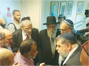  ?? (Tzohar) ?? JEWISH AND MUSLIM religious leaders pray for the well-being of Ahmed Dawabsha at the Chaim Sheba Medical Center at Tel Hashomer on Monday.