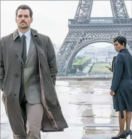  ??  ?? Henry Cavill and Angela Bassett work together to keep a close eye on Tom Cruise’s Ethan in the globetrott­ing "Mission: Impossible — Fallout."