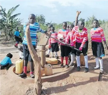  ?? Photo courtesy of Geri Sutts ?? Some of the children supported by Save African Child Uganda use the bore hole that was installed with the financial support of the Rotary Club of Windsor-St. Clair.