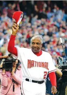  ?? AP PHOTO/EVAN VUCCI ?? In this April 14, 2005, photo, Washington Nationals manager Frank Robinson tips his hat to the crowd as he is introduced during their home opener against the Arizona Diamondbac­ks.