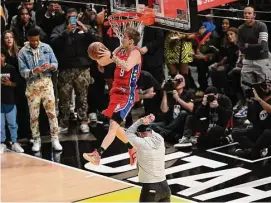  ?? Patrick T. Fallon/AFP/TNS ?? Mac McClung of the Philadelph­ia 76ers competes in the Slam Dunk Contest during NBA All-Star Weekend Saturday in Salt Lake City.