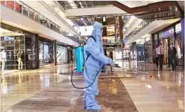  ?? PHOTO: KAMLESH PEDNEKAR ?? A worker in PPE sanitizes the interiors of High Street Phoenix mall in Mumbai’s Lower Parel on Thursday. The Maharashtr­a government has allowed shopping malls and marketplac­es to reopen between 9 am and 7 pm from August 5