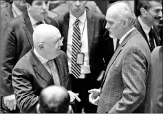  ??  ?? Russian ambassador to the UN Vasily Nebenzya speaks with Syrian Arab Republic Ambassador to the UN Bashar Jaafari after a vote was postponed by the United Nations Security Council demanding a truce in Syria at the United Nations headquarte­rs in New...