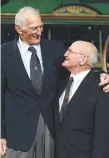  ??  ?? LEGENDS: Norm Provan (left) and Arthur Summons and re-enact the “Gladiators” image.