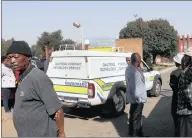  ?? PICTURE: SIMPHIWE MBOKAZI ?? FUNERALS POSTPONED: People wait in vain outside the mortuary in Diepkloof, Soweto, yesterday.