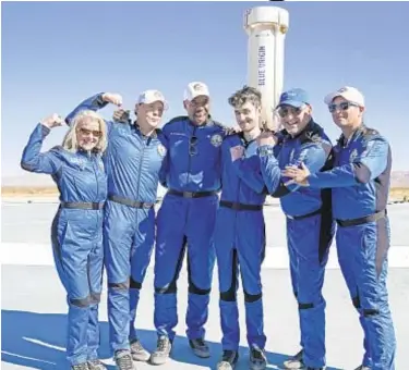  ?? AP ?? Blue Origin passengers (from left), Laura Shepard Churchley, Dylan Taylor, Michael Strahan, Cameron Bess, Lane Bess and Evan Dick in front of the booster rocket at spaceport in Texas on Saturday.