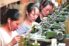  ?? AFP ?? A clothing production line for exports in Xiayi, in Shangqiu. Exports to the EU grew 11.3 per cent in the first seven months.