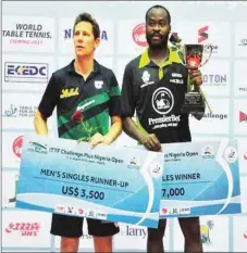  ??  ?? Aruna Quadri ( right) with Austria’s Robert Gardos after the Nigerian retained his title yesterday in Lagos