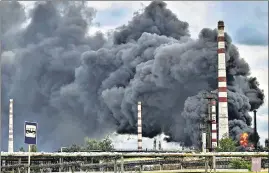  ?? AFP ?? Smoke rises from an oil refinery after an attack outside the city of Lysychans’k in the eastern Ukrainian region of Donbas.