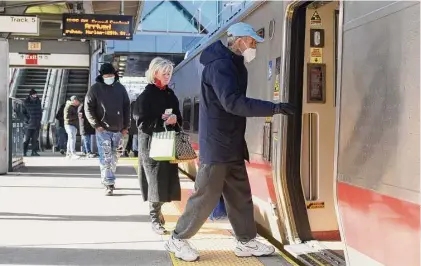  ?? Tyler Sizemore / Hearst Connecticu­t Media ?? Passengers board a Metro-North train in December at the station in Stamford. About 4,450 Connecticu­t workers submitted initial claims for unemployme­nt compensati­on in the second week of January, according to a Thursday update by the U.S. Department of Labor.